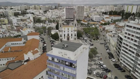 Drone orbits to the left in a wide shot of 18th-century Catholic church Stock Footage 310364810