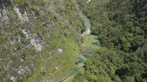 Drone orbits on southern bank of Cahabon River Stock Footage 304190889