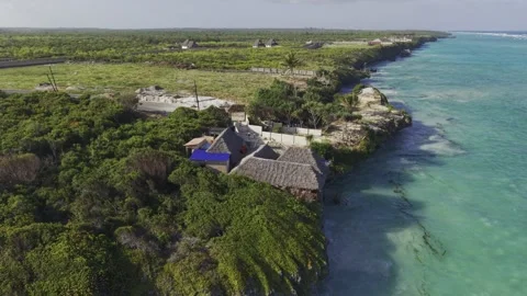 Drone orbits Starfish restaurant during high tide at Mtende Beach Stock Footage 344120060