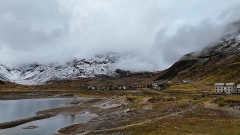 Drone Over Alpine Lake Towards Mountains in Autumn Video stock 320406279