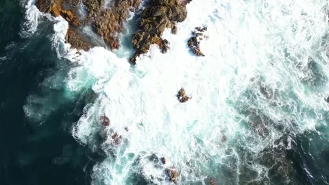 Drone over Azores ocean: waves crash on rocks, creating dramatic seascape. Stock Footage 284913695
