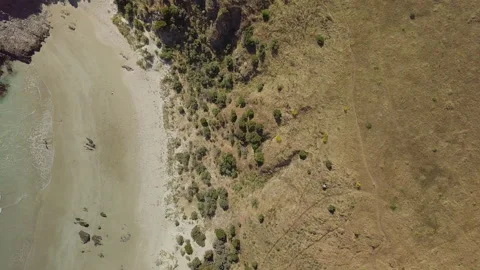 Drone over beach, land meets sea, blue waves, Australia, Blowhole Beach Stock Footage 236362026