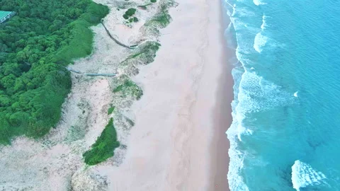 Drone over beach, waves crashing 2 Stock Footage 304222810