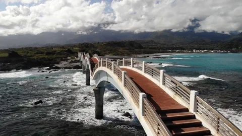 Drone over bridge between land at coastline HD 12 스톡 동영상 129256865