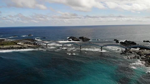 Drone over bridge between land at coastline HD 17 Video stock 129256981