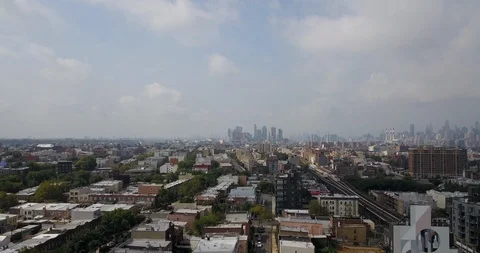 Drone over the Bronx with Manhattan skyline background Stock Footage 114368596
