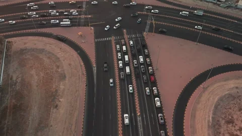 Drone Over Busy Multi-Lane City Intersection at Dusk Stock Footage 324353031