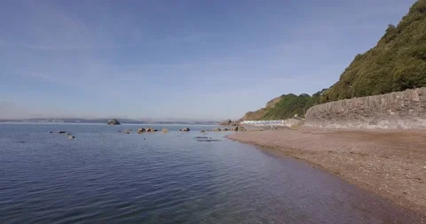 Drone over calm water beach Stock Footage 135763659