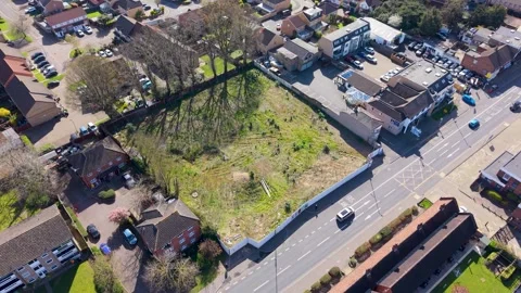 Drone over cleared former Texaco garage site in Cheshunt, Hertfordshire, UK Vídeos de archivo 333344194