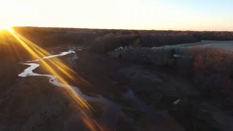 Drone over dry pond at sunset with ray of sun 스톡 동영상 90157614