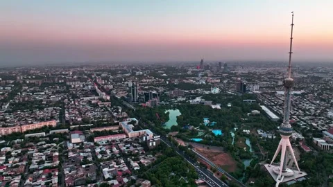 A drone over the evening streets of Tashkent against the backdrop of a sunset. Stock Footage 334920176