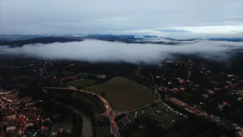 Drone over fields advancing toward a cloud Video stock 347585219
