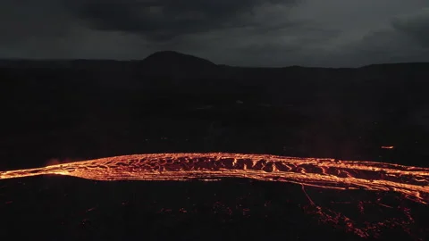 Drone Over Flowing River Of Molten Lava From Erupting Volcano Video stock 168770832