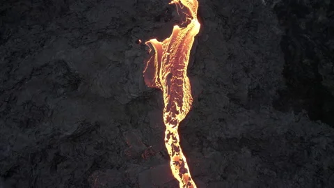 Drone Over Flowing River Of Molten Lava From Erupting Volcano Video stock 168771280