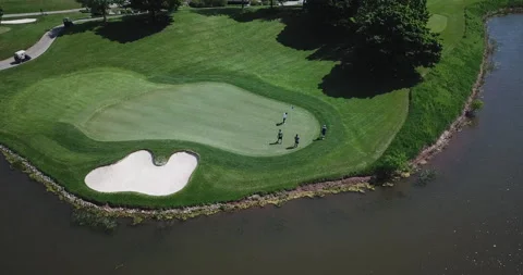 Drone Over Golfers Putting Stock Footage 141980527