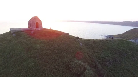 Drone over headland at sunset Stock Footage 81280295