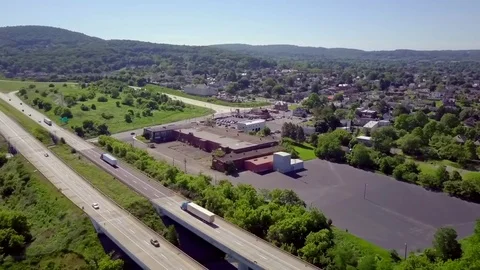 DRONE Over Highway and Building Stock Footage 76851241