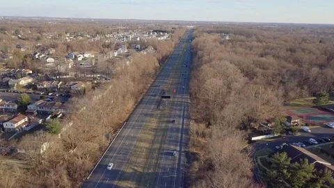 Drone over highway low sun fall trees parallax Stock Footage 104807929
