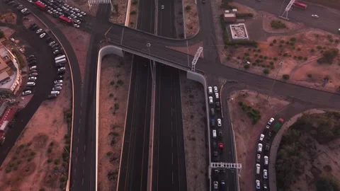 Drone Over Highway Overpass and On-Ramp Queue at Dusk Stock Footage 324352849