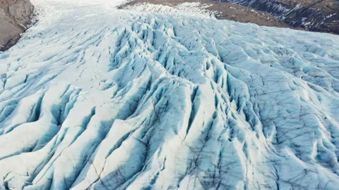 Drone Over Ice In Large Glacier At Foot Of Mountains, Stock Footage 162617688