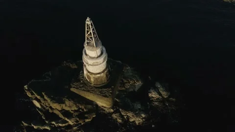 Drone over a lighthouse in the sea Stock Footage 132859691