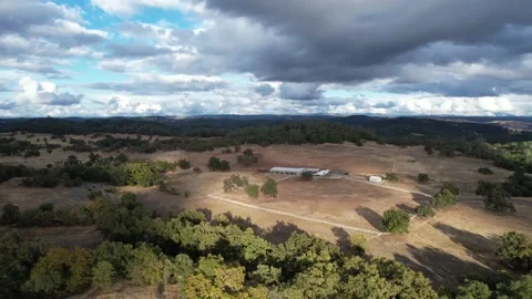 Drone Over Lush Property With Beautiful Clouds (1 of 2) Stockbeeldmateriaal 166319611