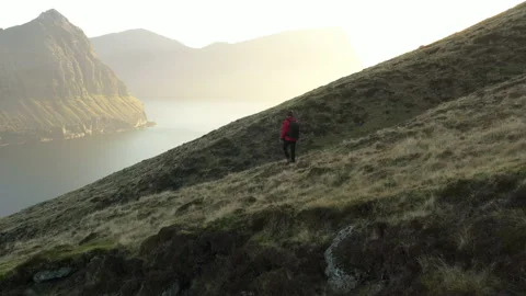 Drone Over Man Hiking Mountains Of Vidareidi Stock Footage 133576802