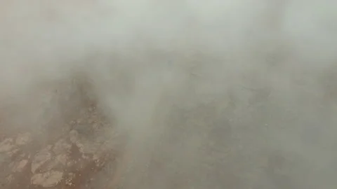 Drone Over Man Walking In Volcanic Landscape Stock Footage 156850639