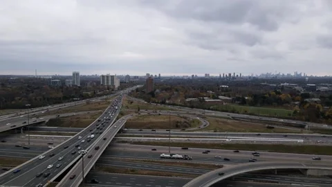 Drone Over Multiple Highways, Watching Traffic and Downtown Toronto Stock Footage 293021919