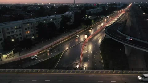 Drone over a night road bridge with passing cars Video stock 335504783