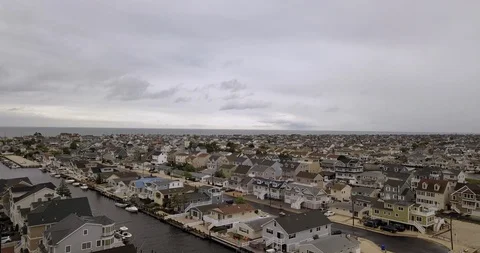 Drone over ocean development overcast 動画素材 111400064