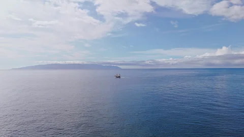 Drone Over Ocean Ship and Tenerife Coast 4K Stock Footage 323857345