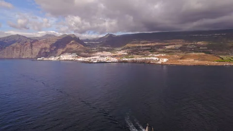 Drone Over Ocean Ship and Tenerife Coast 4K Stock Footage 323857630