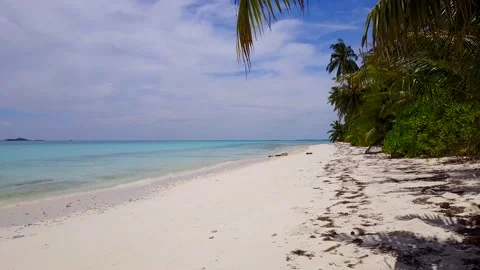 Drone over ocean waves wash sand beach. Aerial shot above unhabited island. Many Stock Footage 201055002