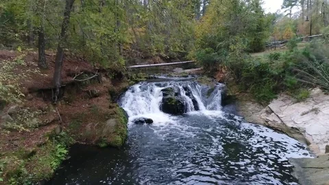 Drone over a Pond's stream and waterfall Vidéo 82243514
