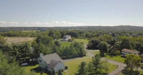 Drone over rich development poughkeepsie NY to single large house 스톡 동영상 95150160
