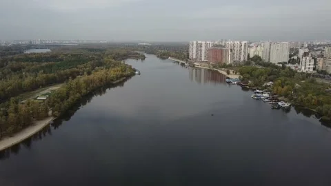 drone over the river. metropolis. river bank, multi-storey buildings. Video stock 141855726