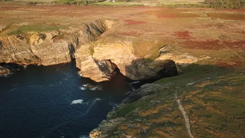 Drone over a rocky seaside camera tilt Stock Footage 164290633