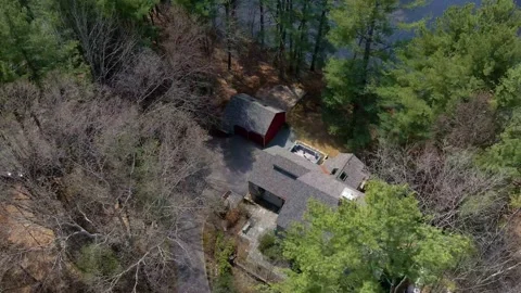 Drone Over Rustic House By Water (4k) Video stock 168330466