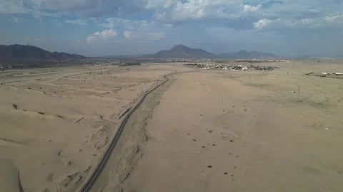 Drone over sand dunes in desert. view of the road through the desert Stock Footage 263277533