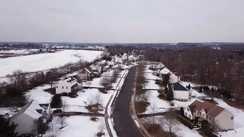 Drone over snow covered development street 스톡 동영상 104316987