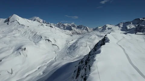 Drone over the snow-covered mountains Stock Footage 323841885