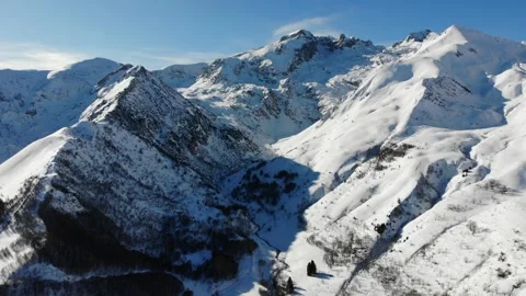 Drone Over Snowy Mountains and Village in Cuneo Italy Slow Cinematic Flight Video stock 331661773
