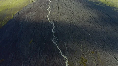 Drone Over Sunlit Landscape With Dry Riverbed Of Braided River Stock Footage 168776352