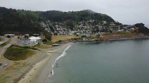 Drone Over Surfers And Waterfront Houses At Foggy California Beach Stockbeeldmateriaal 166319647