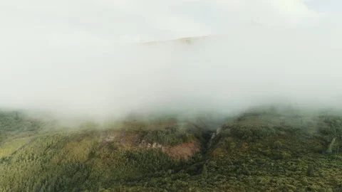 Drone over thick clouds on a mountainside Stock Footage 154523704