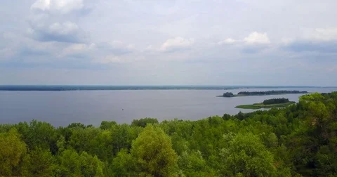 The drone over the trees by the river Stock Footage 77347850