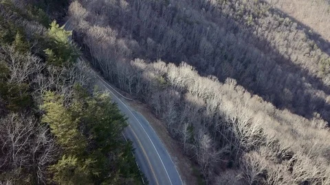 Drone over two lane mountain road 스톡 동영상 103644300