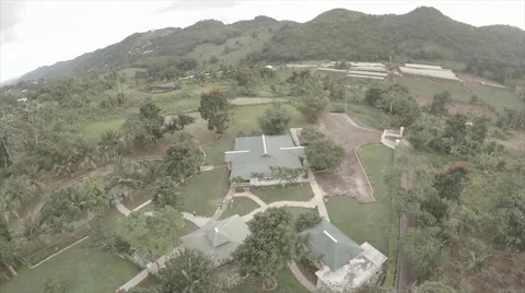 Drone over warehouse in mountain - Caribbean Stock Footage 62528885