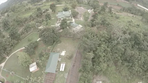 Drone over warehouse in mountain - Caribbean Stock Footage 62528958